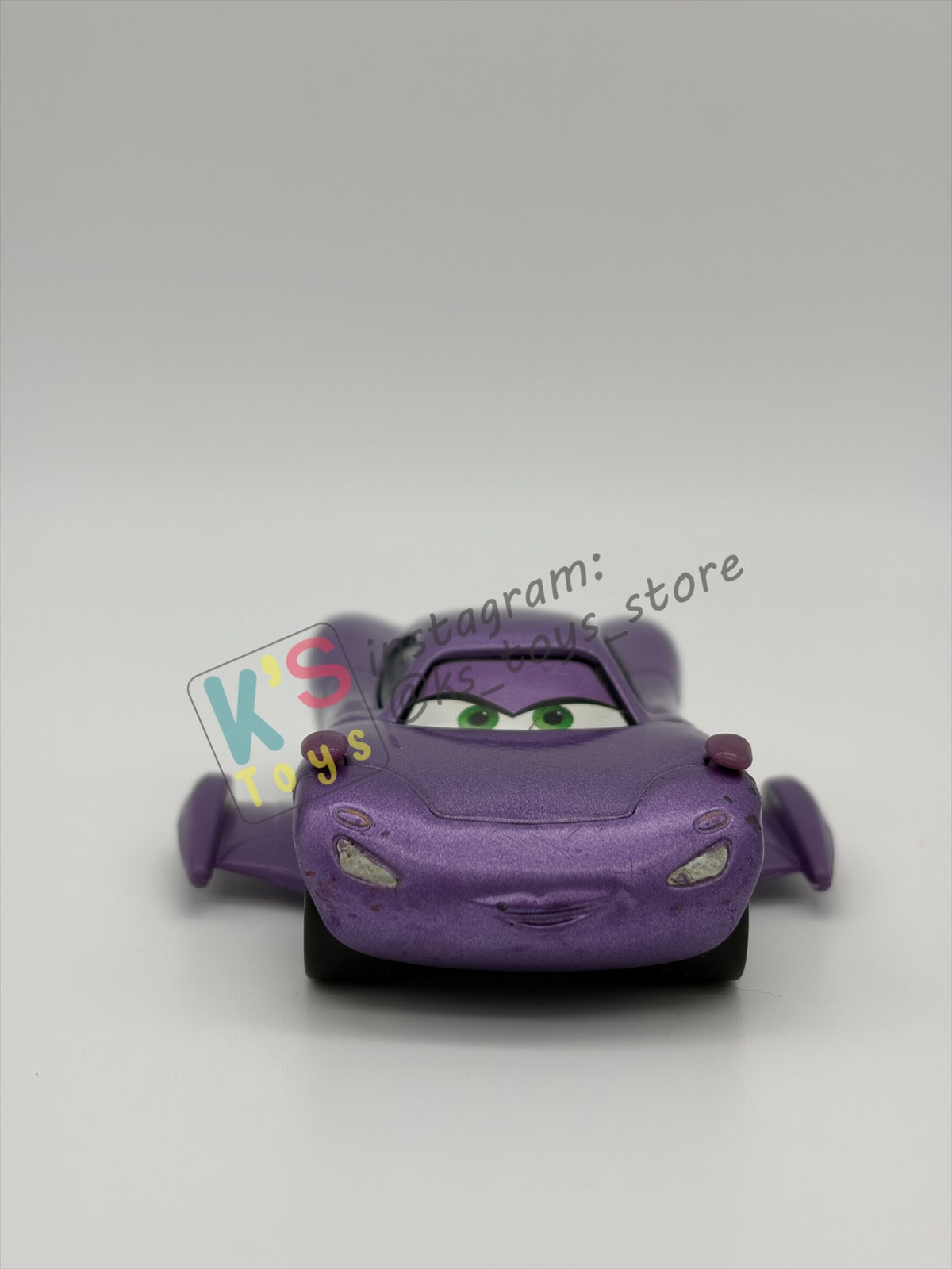 PRE-OWNED / LOOSE DELUXE DISNEY PIXAR CARS BY MATTEL - "HOLLEY SHIFTWELL WITH WINGS" CARS 2 PALACE CHAOS SERIES - GOOD CONDITION