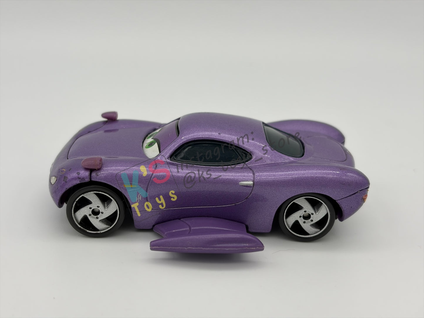 PRE-OWNED / LOOSE DELUXE DISNEY PIXAR CARS BY MATTEL - "HOLLEY SHIFTWELL WITH WINGS" CARS 2 PALACE CHAOS SERIES - GOOD CONDITION