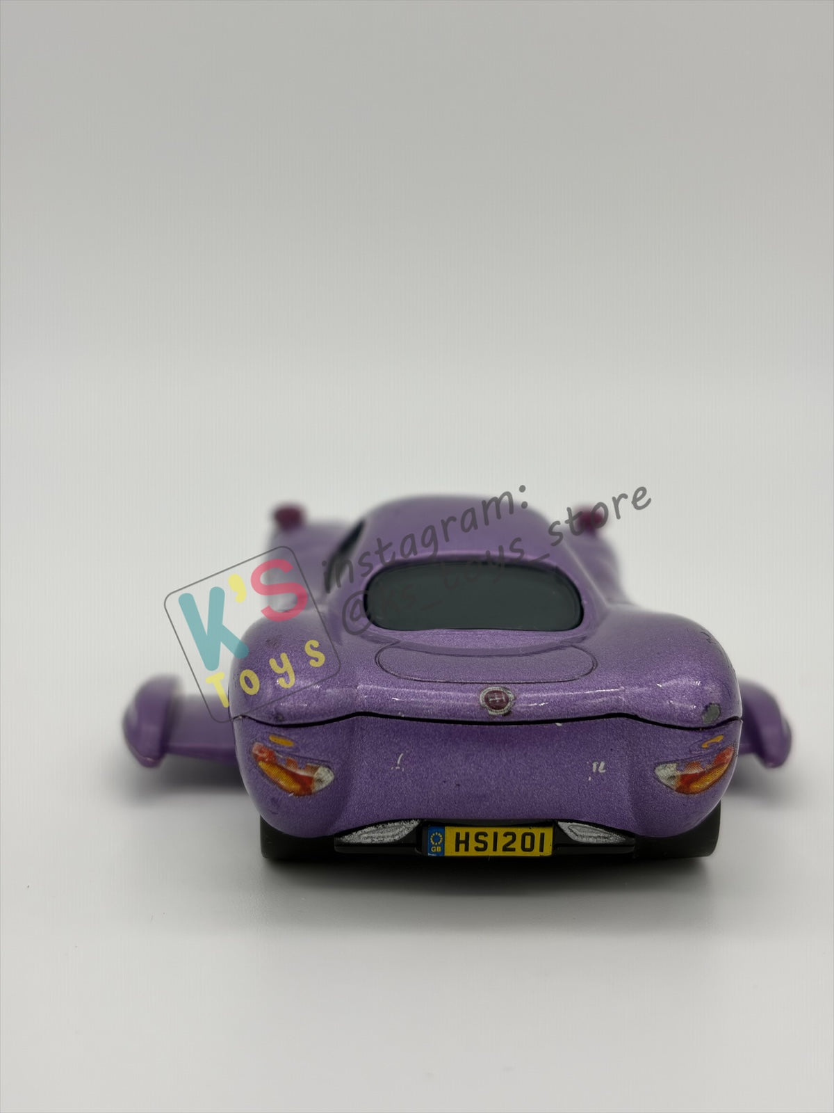 PRE-OWNED / LOOSE DELUXE DISNEY PIXAR CARS BY MATTEL - "HOLLEY SHIFTWELL WITH WINGS" CARS 2 PALACE CHAOS SERIES - GOOD CONDITION