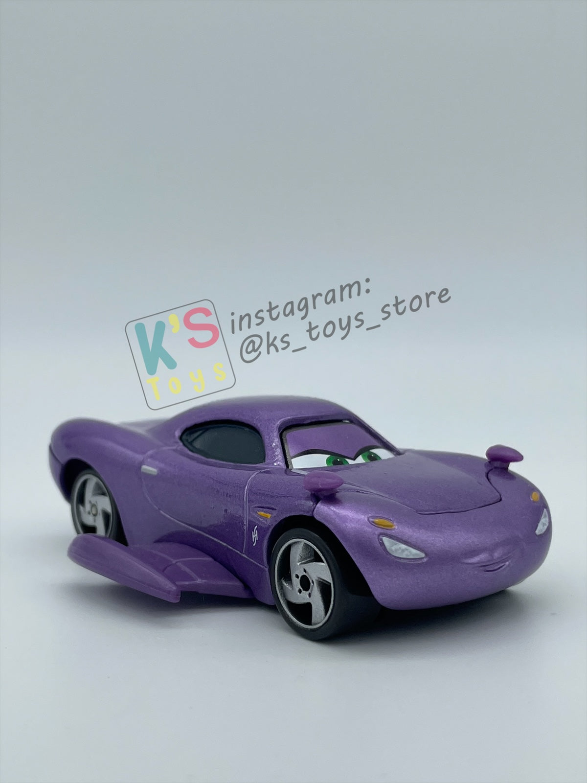 PRE-OWNED / LOOSE DELUXE DISNEY PIXAR CARS BY MATTEL - "HOLLEY SHIFTWELL WITH WINGS" CARS 2 PALACE CHAOS SERIES - MINT CONDITION