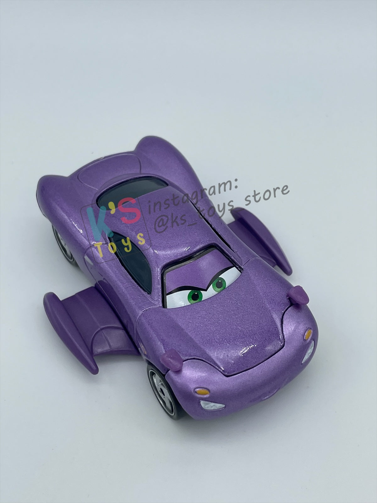 PRE-OWNED / LOOSE DELUXE DISNEY PIXAR CARS BY MATTEL - "HOLLEY SHIFTWELL WITH WINGS" CARS 2 PALACE CHAOS SERIES - MINT CONDITION