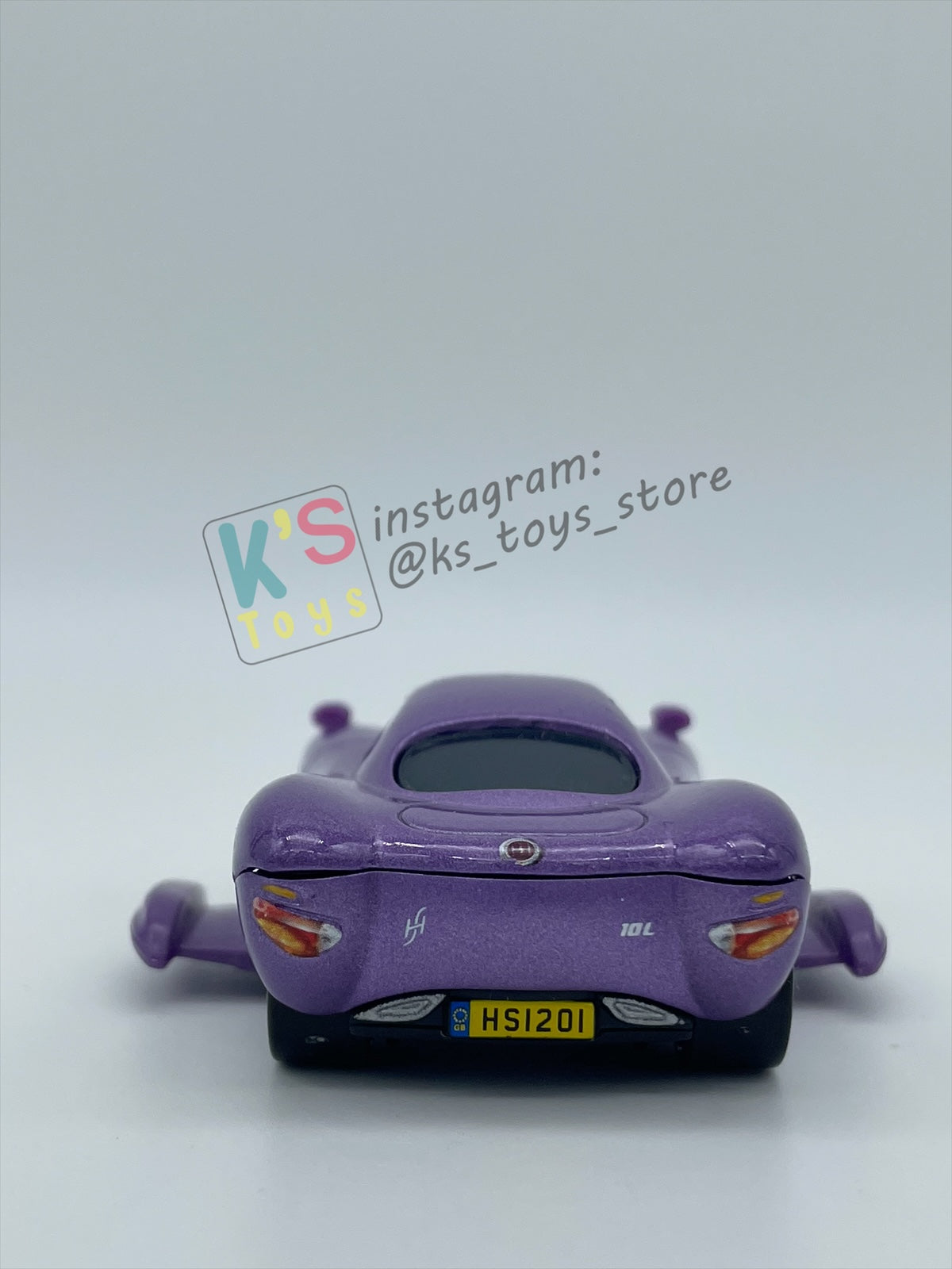 PRE-OWNED / LOOSE DELUXE DISNEY PIXAR CARS BY MATTEL - "HOLLEY SHIFTWELL WITH WINGS" CARS 2 PALACE CHAOS SERIES - MINT CONDITION