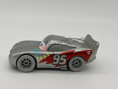 PRE-OWNED / LOOSE DISNEY PIXAR CARS 1:55 BY MATTEL - "DISNEY 100 YEAR SILVER LIGHTNING MCQUEEN" DISNEY 100 YEAR ANNIVERSARY SERIES - NEAR MINT CONDITION