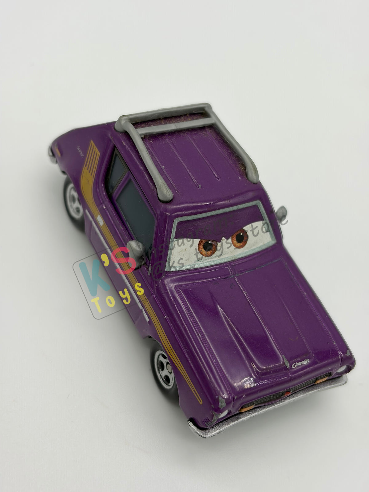 PRE-OWNED / LOOSE DISNEY PIXAR CARS - “J. CURBY GREMLIN" - CARS 2 LEMONS SERIES - NEAR MINT CONDITION