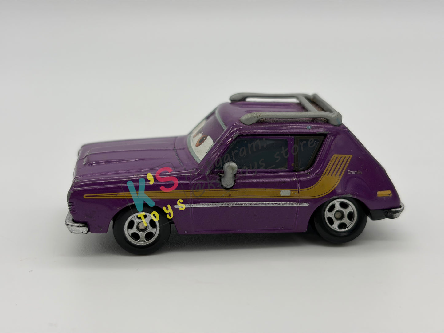 PRE-OWNED / LOOSE DISNEY PIXAR CARS - “J. CURBY GREMLIN" - CARS 2 LEMONS SERIES - NEAR MINT CONDITION
