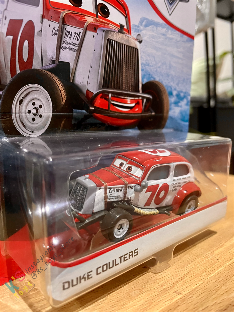 DISNEY PIXAR CARS "DUKE COULTERS" DOC'S RACING - BNIP