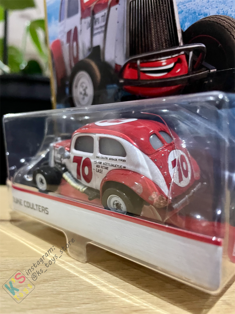 DISNEY PIXAR CARS "DUKE COULTERS" DOC'S RACING - BNIP