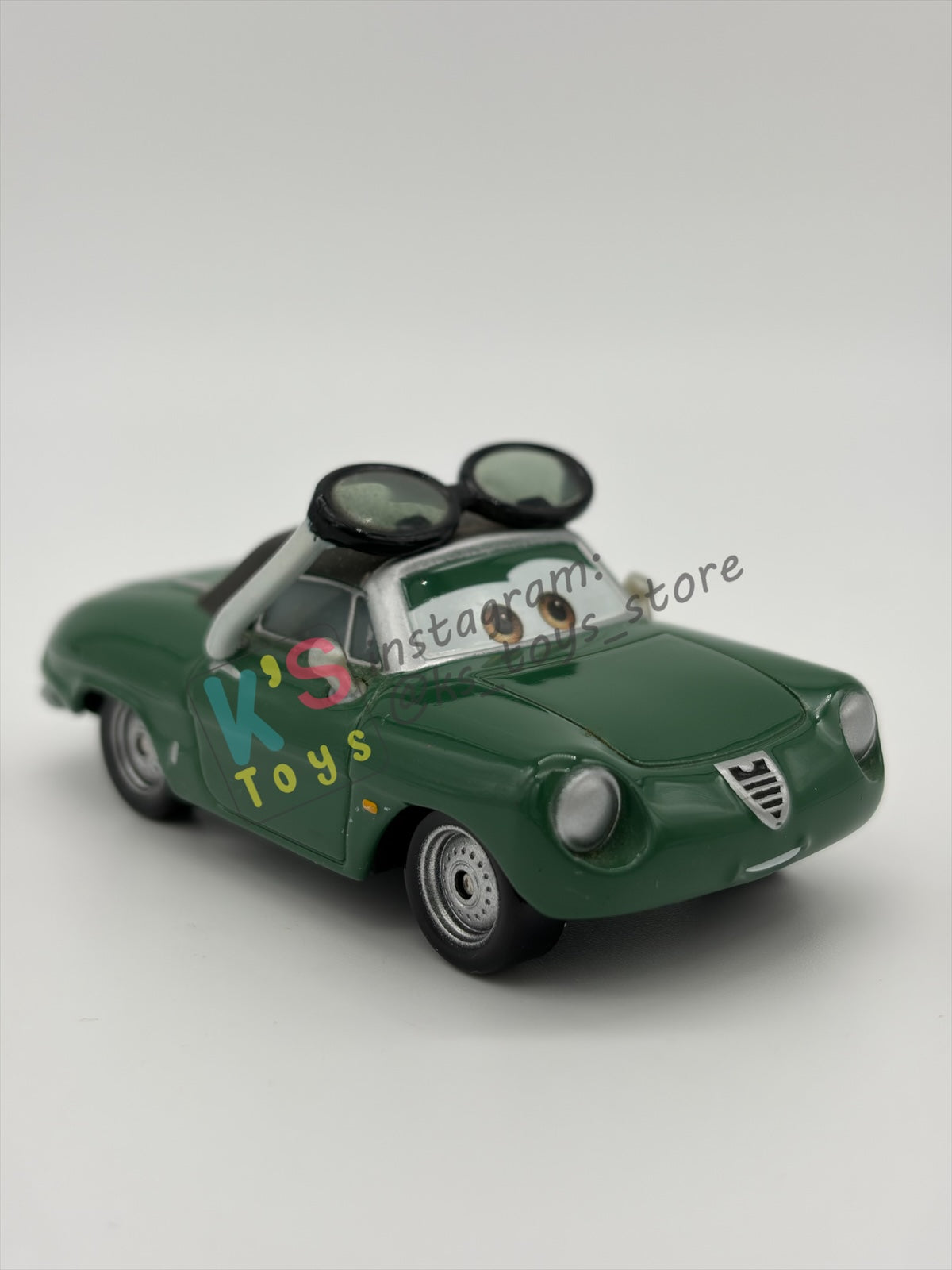 PRE-OWNED / LOOSE DISNEY PIXAR CARS BY MATTEL - "CARINNE CAVVY" - CARS 2 RACE FANS - NEAR MINT CONDITION - READ DESCRIPTION!!!!!!!!!!!