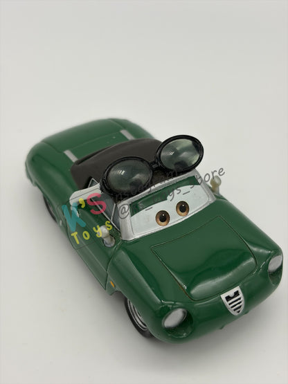 PRE-OWNED / LOOSE DISNEY PIXAR CARS BY MATTEL - "CARINNE CAVVY" - CARS 2 RACE FANS - NEAR MINT CONDITION - READ DESCRIPTION!!!!!!!!!!!
