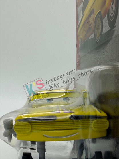 DISNEY PIXAR CARS BY MATTEL 1:55, "YELLOW HYDRAULIC RAMONE" - 2OTH CARD/PACKAGING - BNIP