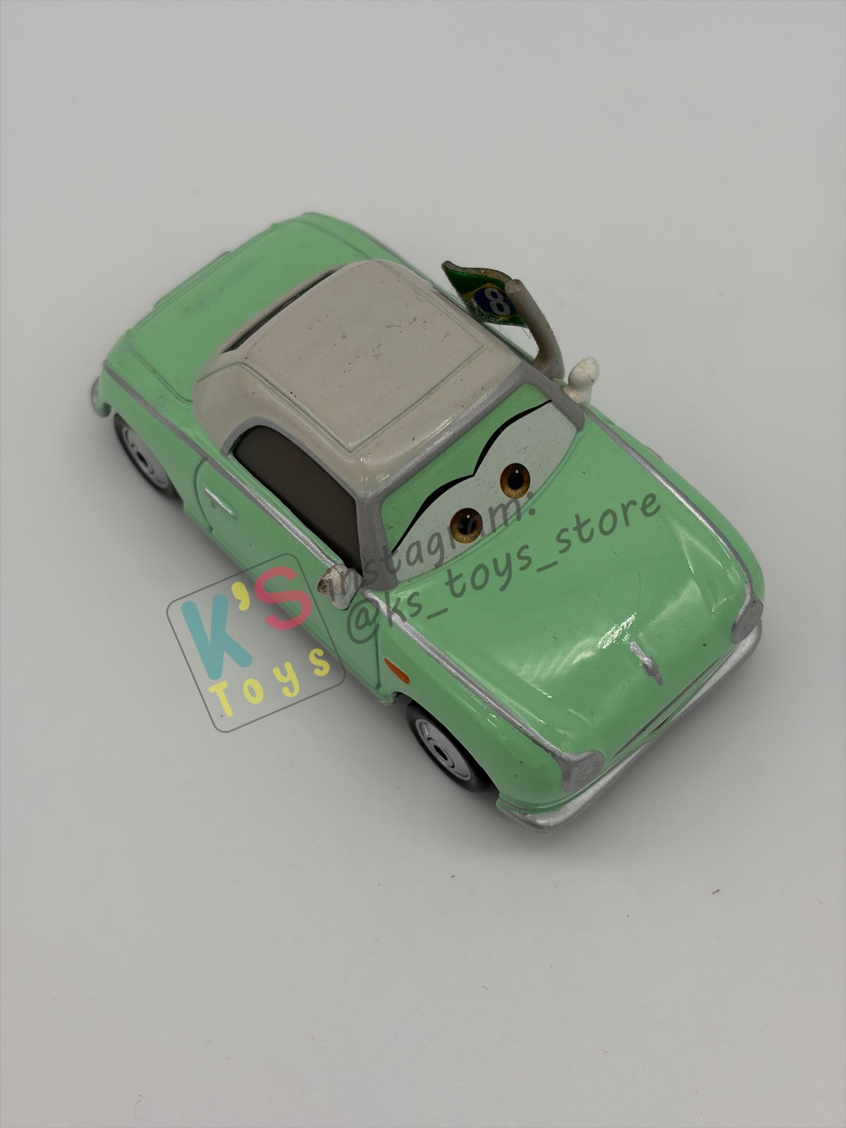PRE-OWNED / LOOSE DISNEY PIXAR CARS BY MATTEL - "DENISE BEAM (UNIBODY)" CARS 2 RACE FANS SERIES - NEAR MINT CONDITION
