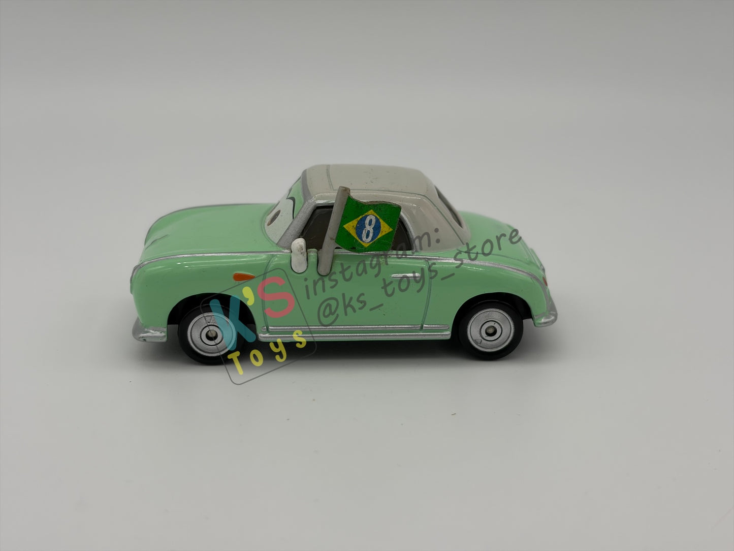 PRE-OWNED / LOOSE DISNEY PIXAR CARS BY MATTEL - "DENISE BEAM (UNIBODY)" CARS 2 RACE FANS SERIES - NEAR MINT CONDITION