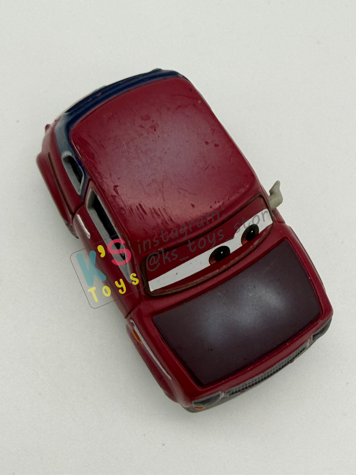 PRE-OWNED / LOOSE DISNEY PIXAR CARS 1:55 BY MATTEL - "JUSTIN PARTSON" CARS 2 PARIS PARTS MARKET SERIES - NEAR MINT CONDITION