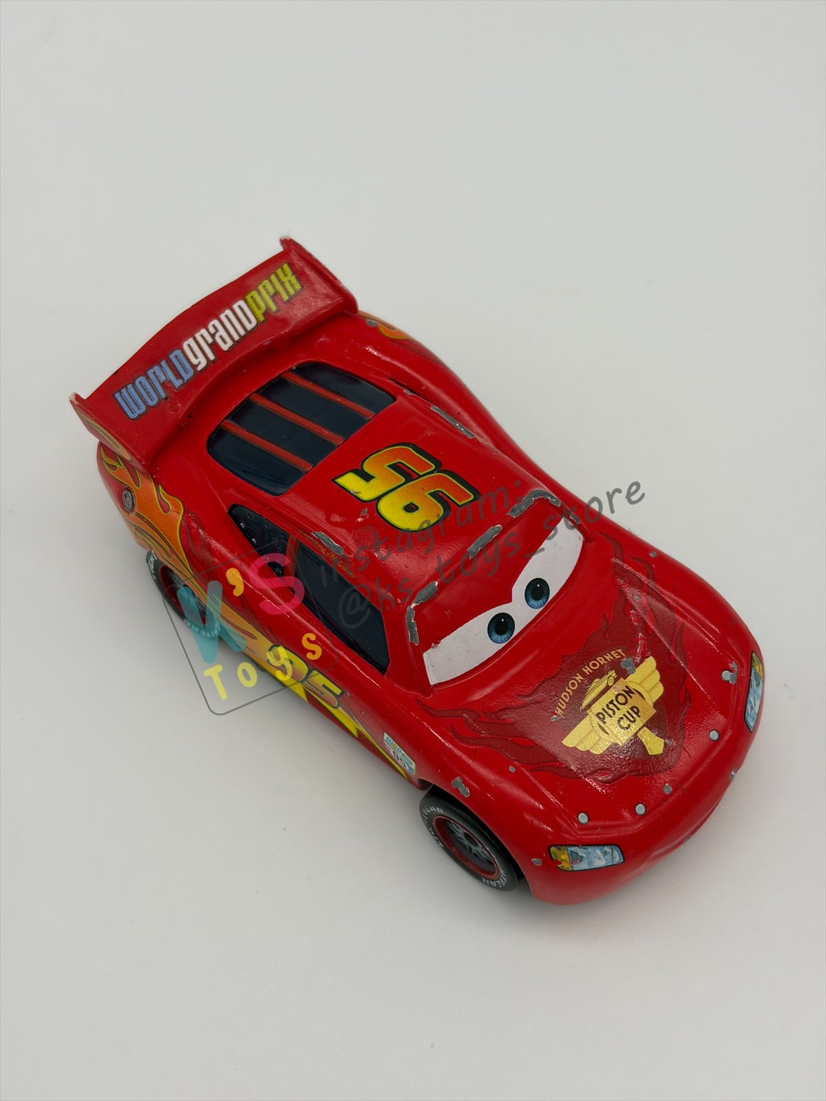 PRE-OWNED / LOOSE DISNEY PIXAR CARS - "LIGHTNING MCQUEEN RACING WHEELS UNIBODY VARIANT" CARS 2 WGP SERIES - PLAYED CONDITION - READ DESCRIPTION!!!!!!!!!!