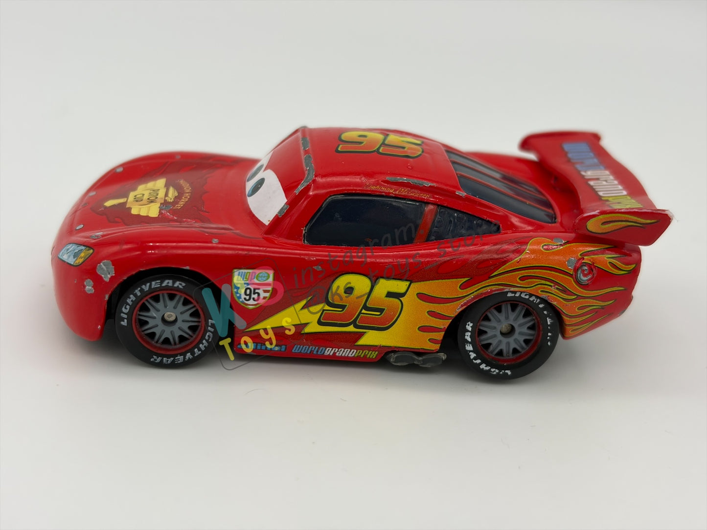 PRE-OWNED / LOOSE DISNEY PIXAR CARS - "LIGHTNING MCQUEEN RACING WHEELS UNIBODY VARIANT" CARS 2 WGP SERIES - PLAYED CONDITION - READ DESCRIPTION!!!!!!!!!!