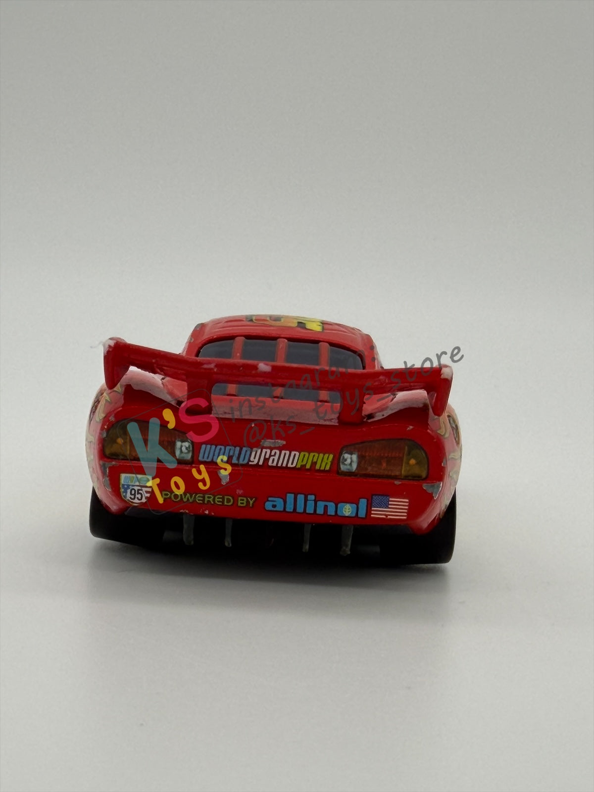 PRE-OWNED / LOOSE DISNEY PIXAR CARS - "LIGHTNING MCQUEEN RACING WHEELS UNIBODY VARIANT" CARS 2 WGP SERIES - PLAYED CONDITION - READ DESCRIPTION!!!!!!!!!!