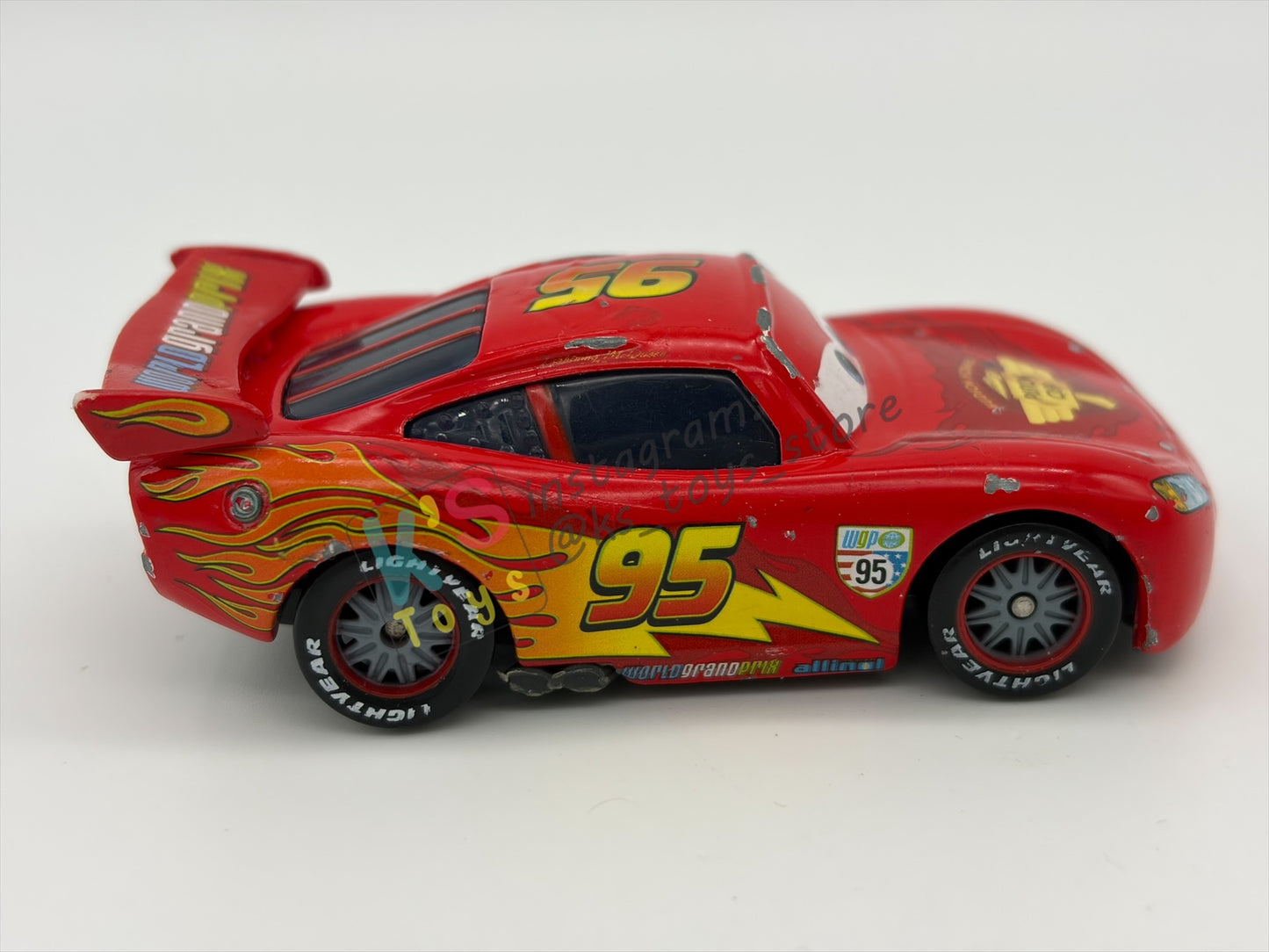 PRE-OWNED / LOOSE DISNEY PIXAR CARS - "LIGHTNING MCQUEEN RACING WHEELS UNIBODY VARIANT" CARS 2 WGP SERIES - PLAYED CONDITION - READ DESCRIPTION!!!!!!!!!!