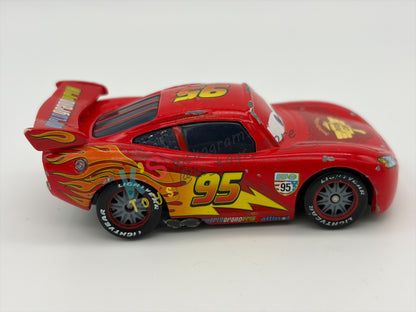 PRE-OWNED / LOOSE DISNEY PIXAR CARS - "LIGHTNING MCQUEEN RACING WHEELS UNIBODY VARIANT" CARS 2 WGP SERIES - PLAYED CONDITION - READ DESCRIPTION!!!!!!!!!!