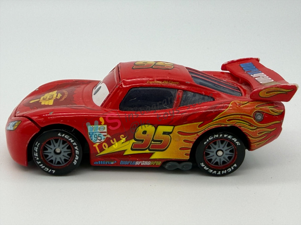 PRE-OWNED / LOOSE DISNEY PIXAR CARS BY MATTEL - "LIGHTNING MCQUEEN WITH RACING WHEELS" CARS 2 SERIES - PLAYED IN GOOD CONDITION - READ DESCRIPTION!!!!!!!!!!