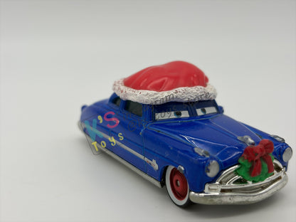 PRE-OWNED / LOOSE DISNEY PIXAR CARS - "DECKED OUT DOC HUDSON" - MATER SAVES CHRISTMAS - PLAYED IN GOOD CONDITION