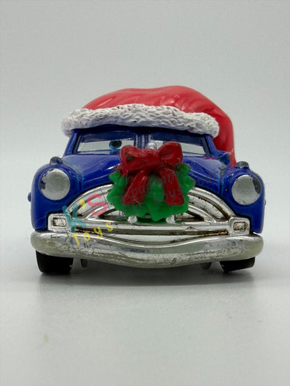 PRE-OWNED / LOOSE DISNEY PIXAR CARS - "DECKED OUT DOC HUDSON" - MATER SAVES CHRISTMAS - PLAYED IN GOOD CONDITION