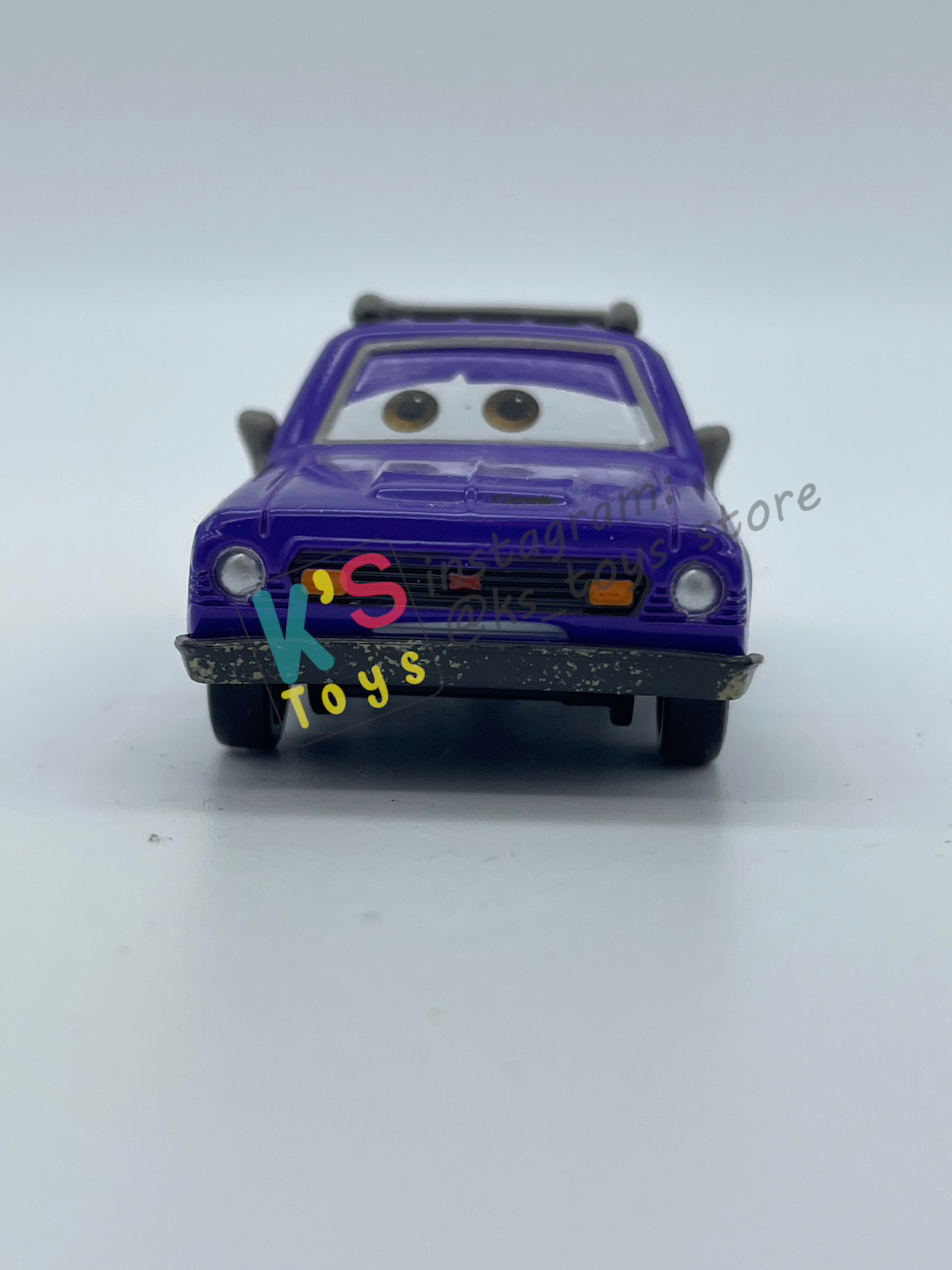 PRE-OWNED / LOOSE DISNEY PIXAR CARS 1:55 BY MATTEL - "DON CRUMLIN (BROWN EYES VARIANT)" CARS 2 LONDON CHASE SERIES - NEAR MINT CONDITION