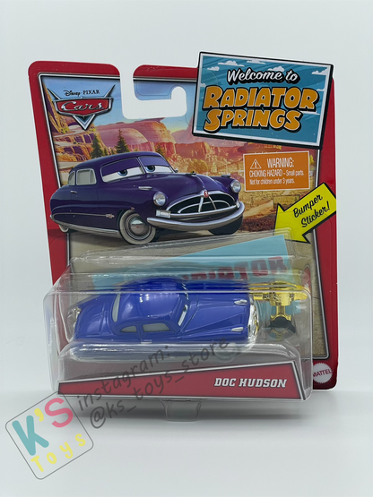 Disney Pixar Cars by MATTEL, DOC HUDSON, BONUS BUMPER STICKER AND PISTON CUP - WELCOME TO RADIATOR SPRINGS - BNIP