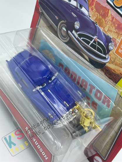 Disney Pixar Cars by MATTEL, DOC HUDSON, BONUS BUMPER STICKER AND PISTON CUP - WELCOME TO RADIATOR SPRINGS - BNIP