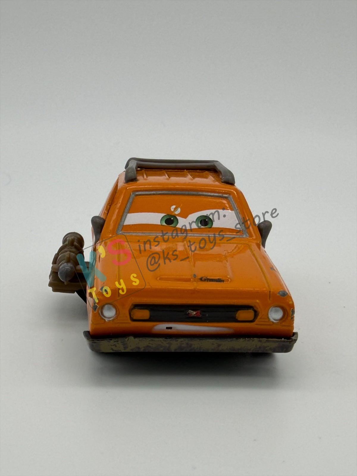 PRE-OWNED / LOOSE DISNEY PIXAR CARS - “GREM WITH WEAPON" - CARS 2 AIRPORT ADVENTURE SERIES - GOOD CONDITION