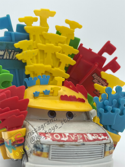 PRE-OWNED / LOOSE DISNEY PIXAR CARS - "BRIAN MOTOR SPARK - SOUVENIRS GUY" - CARS 1 SERIES, MEGA SIZE - PLAYED CONDITION